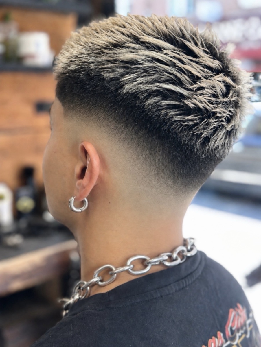 A textured spiky crop with blonde tips and a clean skin fade, cut at The Clip Joint Hackney